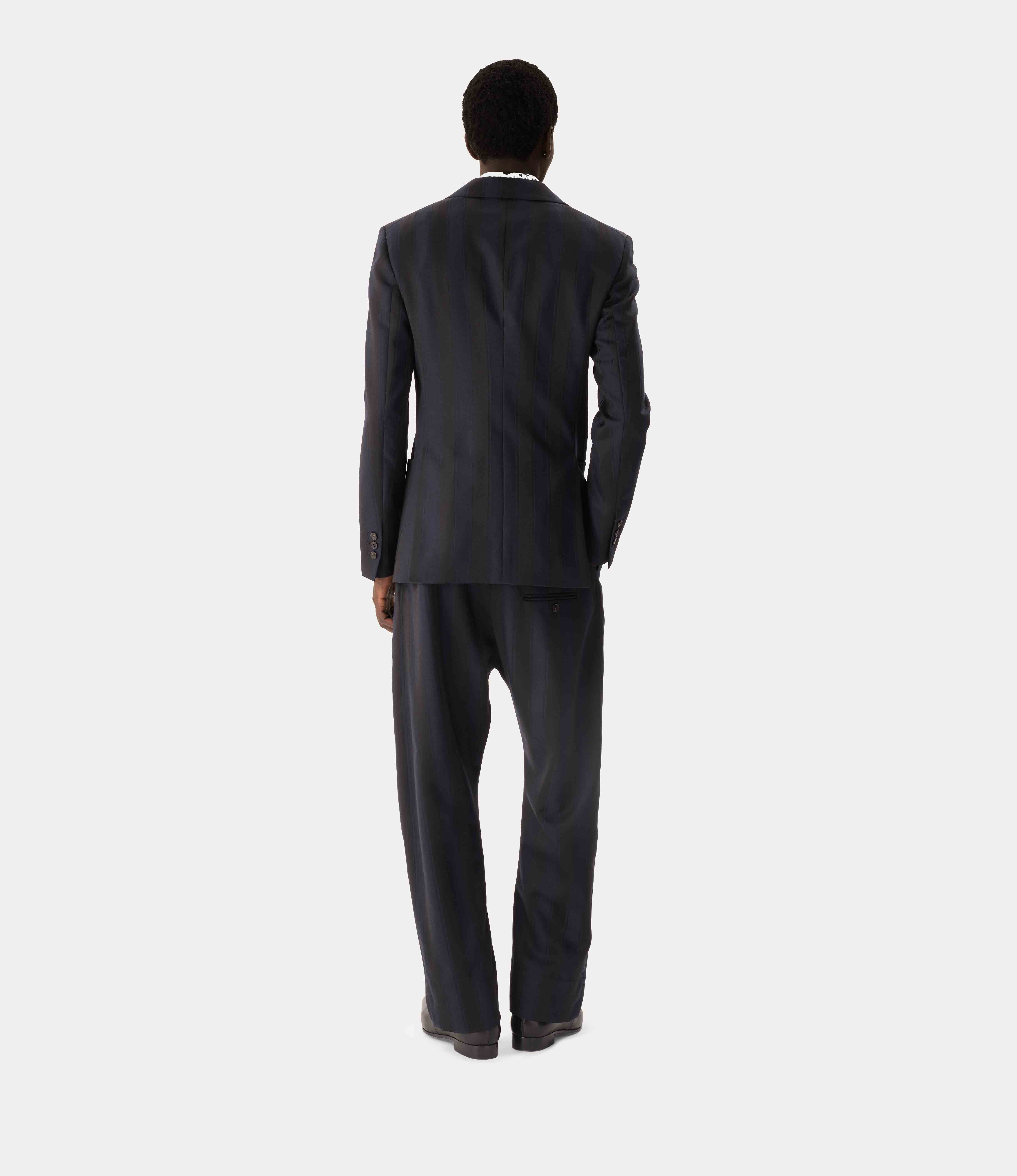 Back view of Vivienne Westwood Swing Corset Trousers in Midnight Blue Black showing detachable corset waistband, rear belt fastening and straight-leg fit