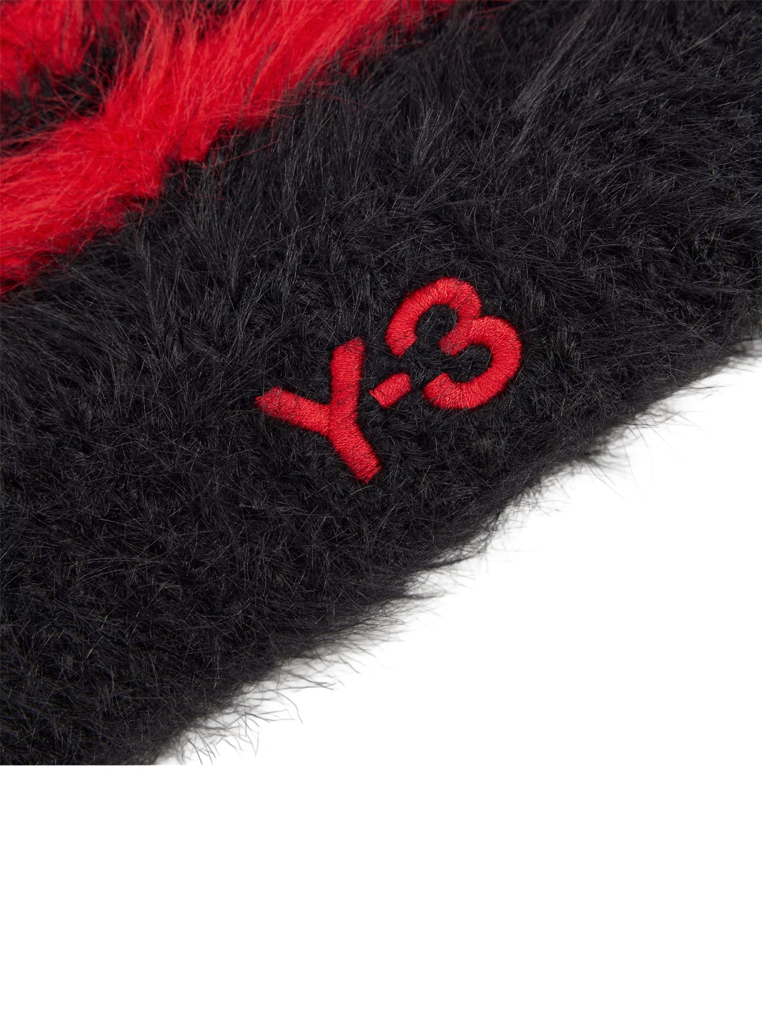 Close-up of the embroidered Y-3 logo on the Black / Scarlet beanie