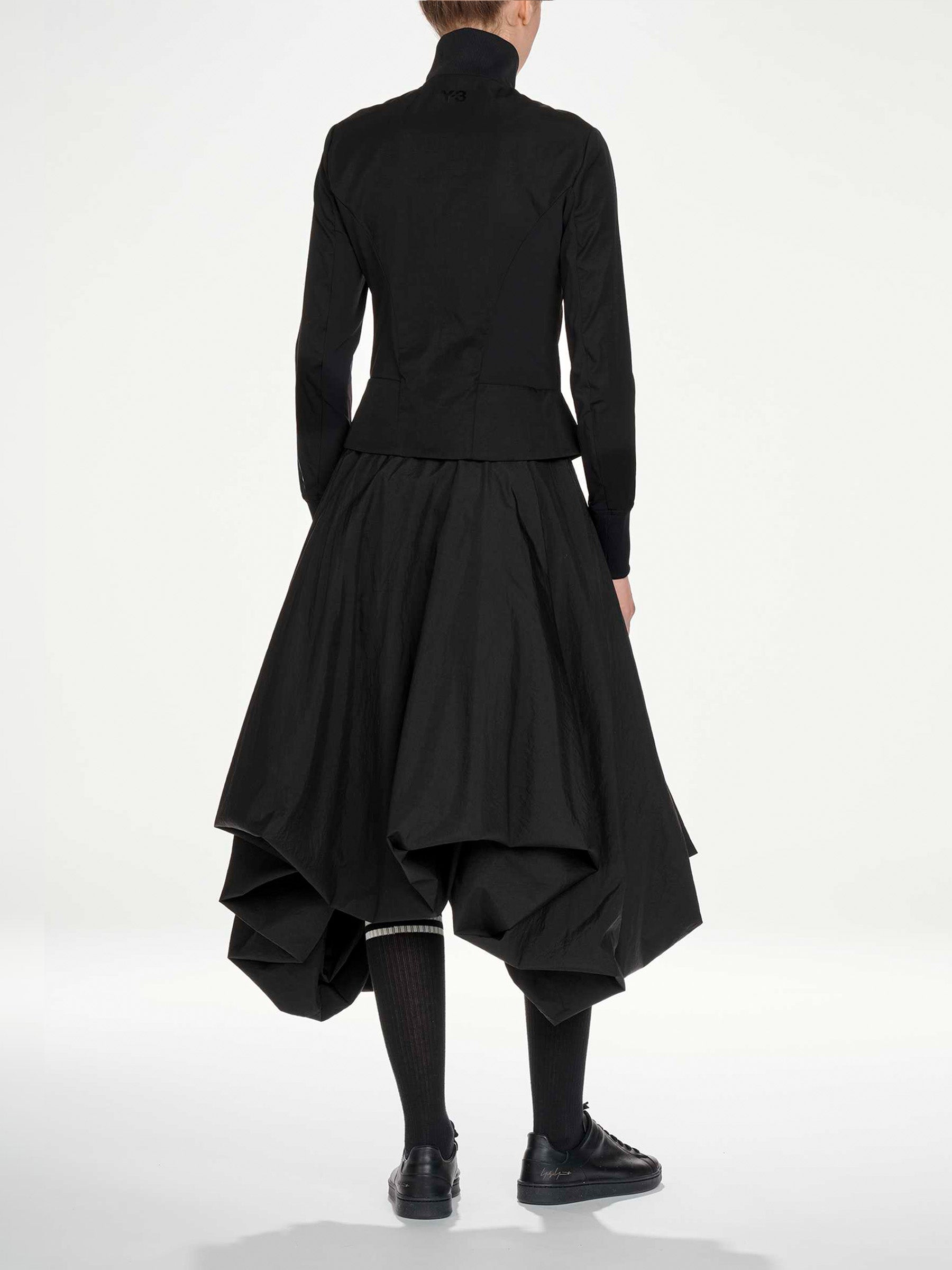 Y-3 AW26 3-Stripes Nylon Track Top in Black - side view on model showing fitted silhouette and nylon fabric