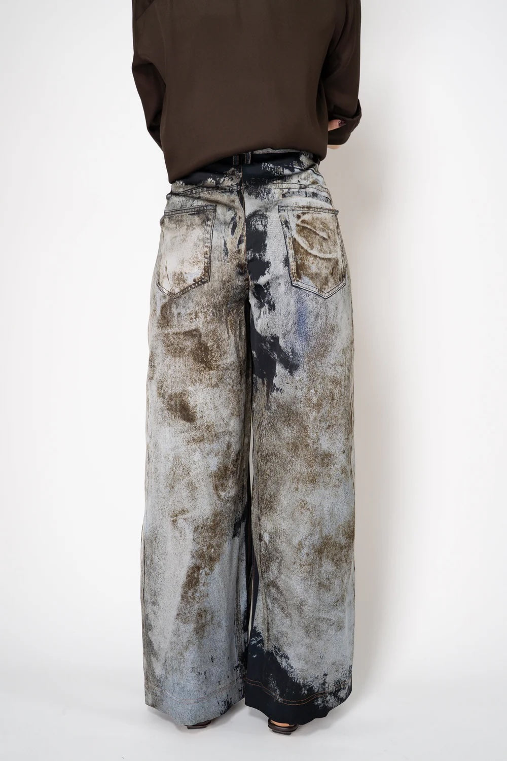 Annette Görtz printed denim trousers, back view showing back welted pocket and wide-leg silhouette