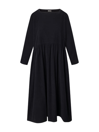 Front view of the Black Crane Tradi Dress in dark navy corduroy, featuring a square boat neckline, long sleeves, a long straight skirt, and a straight hem.