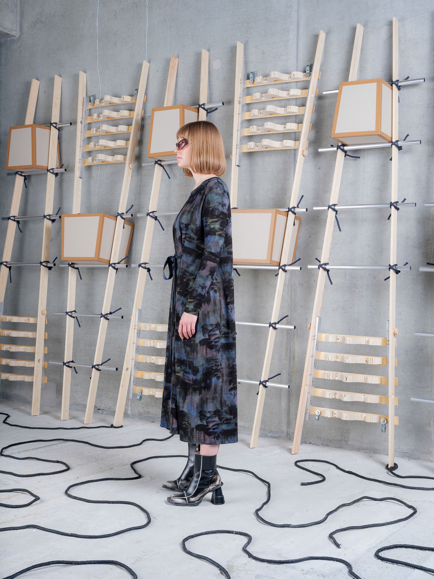 Model wearing Henrik Vibskov Carry O Dress in Mushroom Tapestry side view