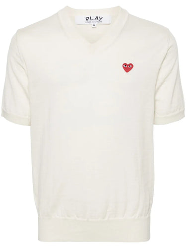 Packshot of the Comme des Garçons Play Unisex V-Neck Sweater Short-Sleeve in off white, featuring a clean wool construction, V-neckline, short sleeves, and minimalist unisex silhouette.
