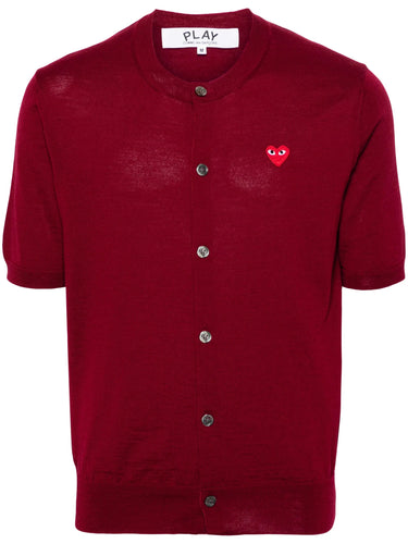 Red short-sleeve cardigan with a red heart logo from Comme des Garcons Play on a white background