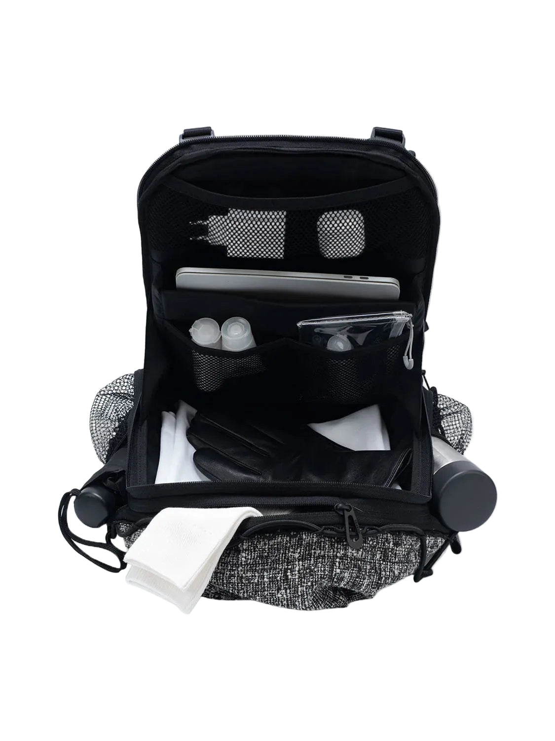 Open Côte & Ciel Ladon Tweed in Black & Cream backpack showing laptop compartment, mesh pockets and organised interior
