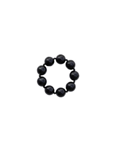Black and round obsidian bracelet from De Silang on a white background