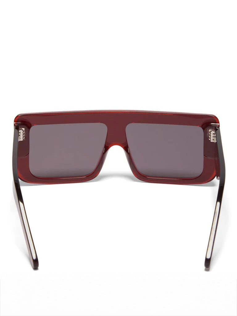Back view of Rick Owens Documenta Sunglasses in Blood Temple/Black Lens showing wide temples, black lens and silver rivet detailing
