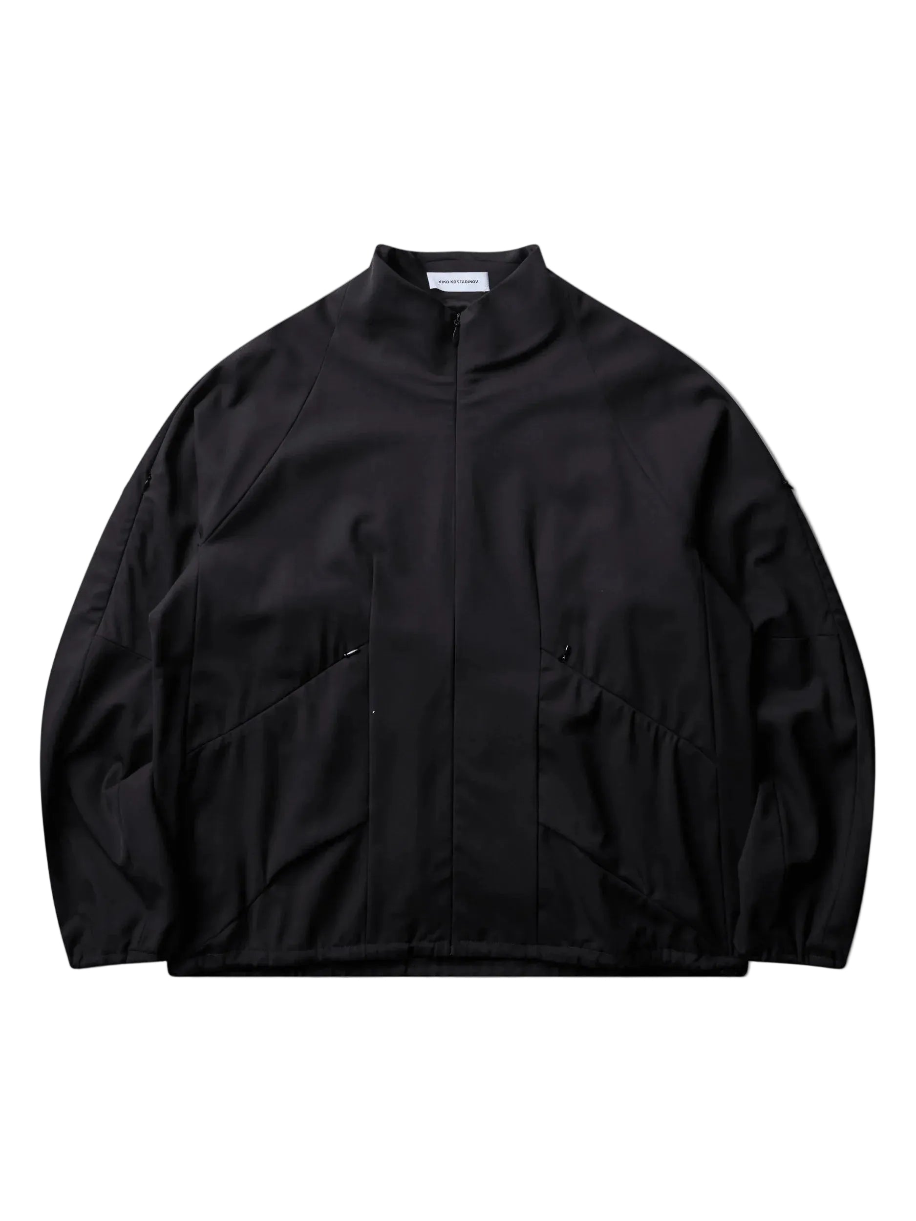 Kiko Kostadinov Erdiko Jacket in Crow Black stretch virgin wool twill with funnel neck, concealed zip closure, raglan sleeves and zip waist pockets
