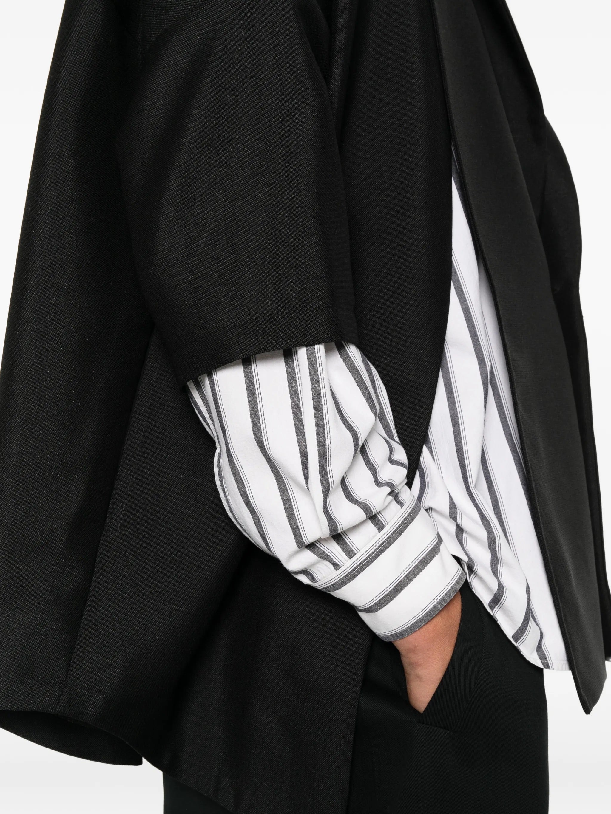 House Of The Very Islands Esra Shirt in Black - detail view showing short sleeve and mohair wool fabric texture