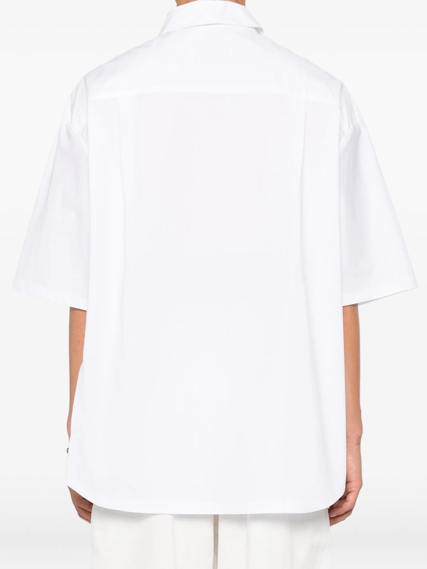 House Of The Very Islands Harley Asymmetric Shirt in White - back view on model showing yoke detail and relaxed silhouette
