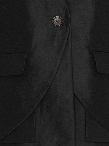 Close-up of the Beetle Blazer highlighting the black Tencel-linen fabric and layered construction.