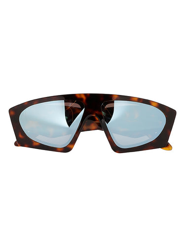 Sunglasses with tortoiseshell frame and reflective lenses on a white background