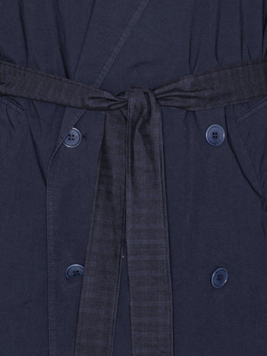 Close-up of the Dimout Long Coat in Navy, highlighting the textured dark check details, double-breasted buttons, and blazer-style collar.