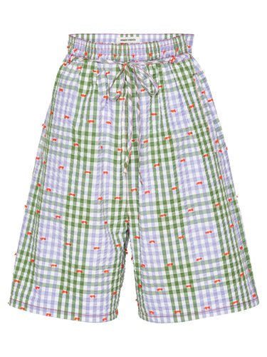 Front view of the Henrik Vibskov Drawstring Shorts in Checks Fillé, showing the purple and green checked pattern, orange contrast stitching, elastic drawstring waistband, and knee-length cut.