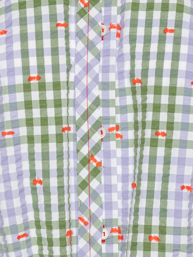 Close-up of the Henrik Vibskov Flat Shirt in Checks Fillé, highlighting the purple and green checks, orange stitching, and button details.