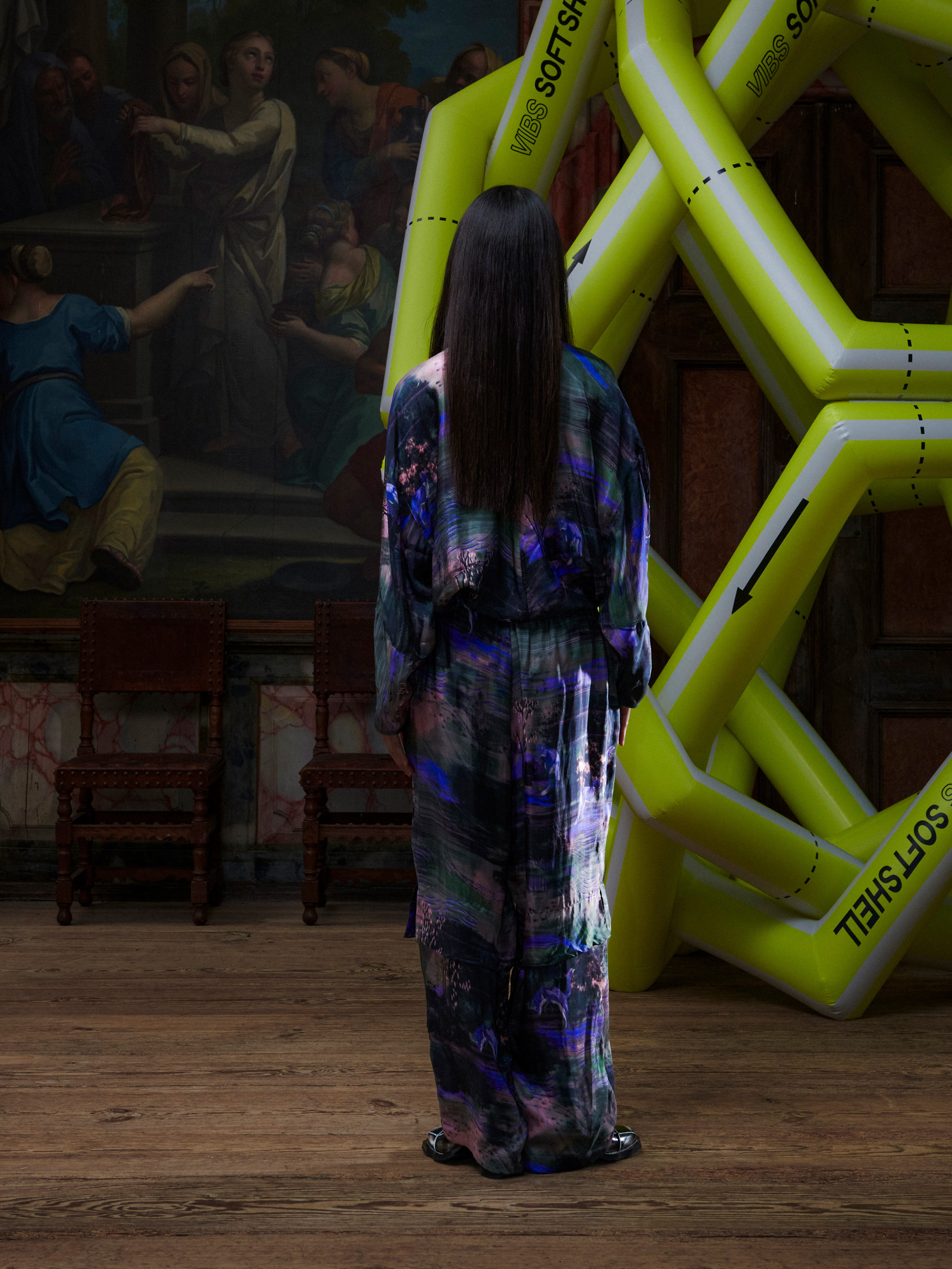 Model wearing the Henrik Vibskov Flat Shirt in Foxes, back view, showing the full abstract fox and nature pattern and cropped silhouette.