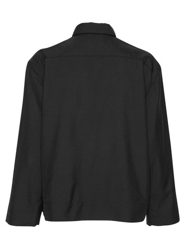 Back view of the Henrik Vibskov Lonely Sjacket in Tropical Wool, showing the clean black wool fabric, long sleeves, and cropped straight hem.