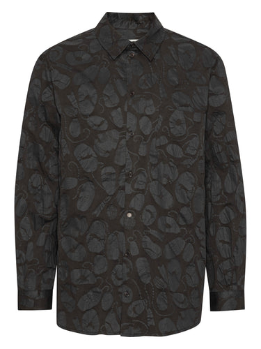 Front view of the Henrik Vibskov New Blou Shirt in Black Amulets, showing the black fabric with tonal amulets pattern, collar, front button closure, long sleeves, chest pocket, and straight hem.