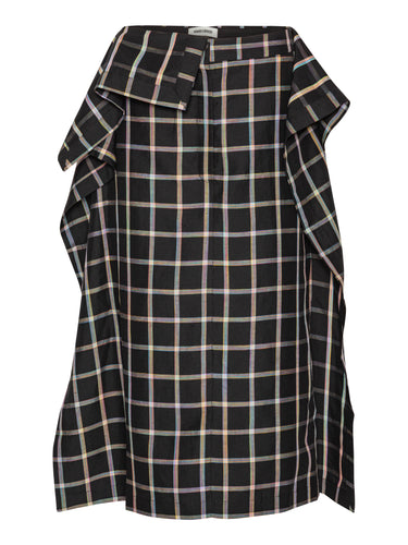 Front view of the Henrik Vibskov Ocu Skirt in Black Checks, showing the black check pattern, extra fabric design, side pockets, side slit, and straight hem.