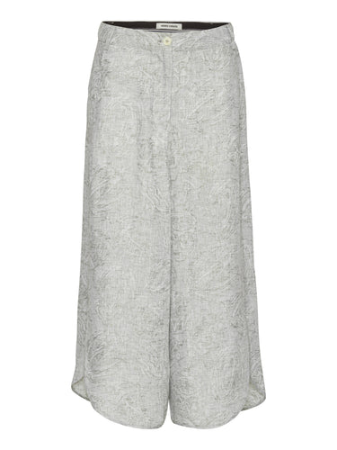 Front view of Henrik Vibskov Overlap Pants in grey textured floral fabric with wide legs and curved hem.