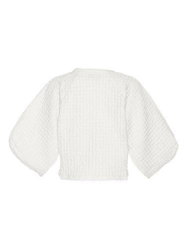 Back view of the Persey Top highlighting the straight cropped hem and full shape of the 3/4 sleeves.