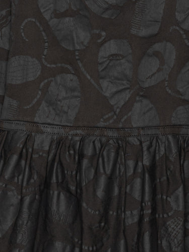 Close-up of the Henrik Vibskov Preserve Blouse in Black Amulets, highlighting the amulet pattern, V-neck detail, and fabric texture.