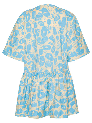 Back view of the Henrik Vibskov Preserve Blouse in Ecru Amulets, showing the oversized fit, short sleeves, and wide, knee-length skirt.