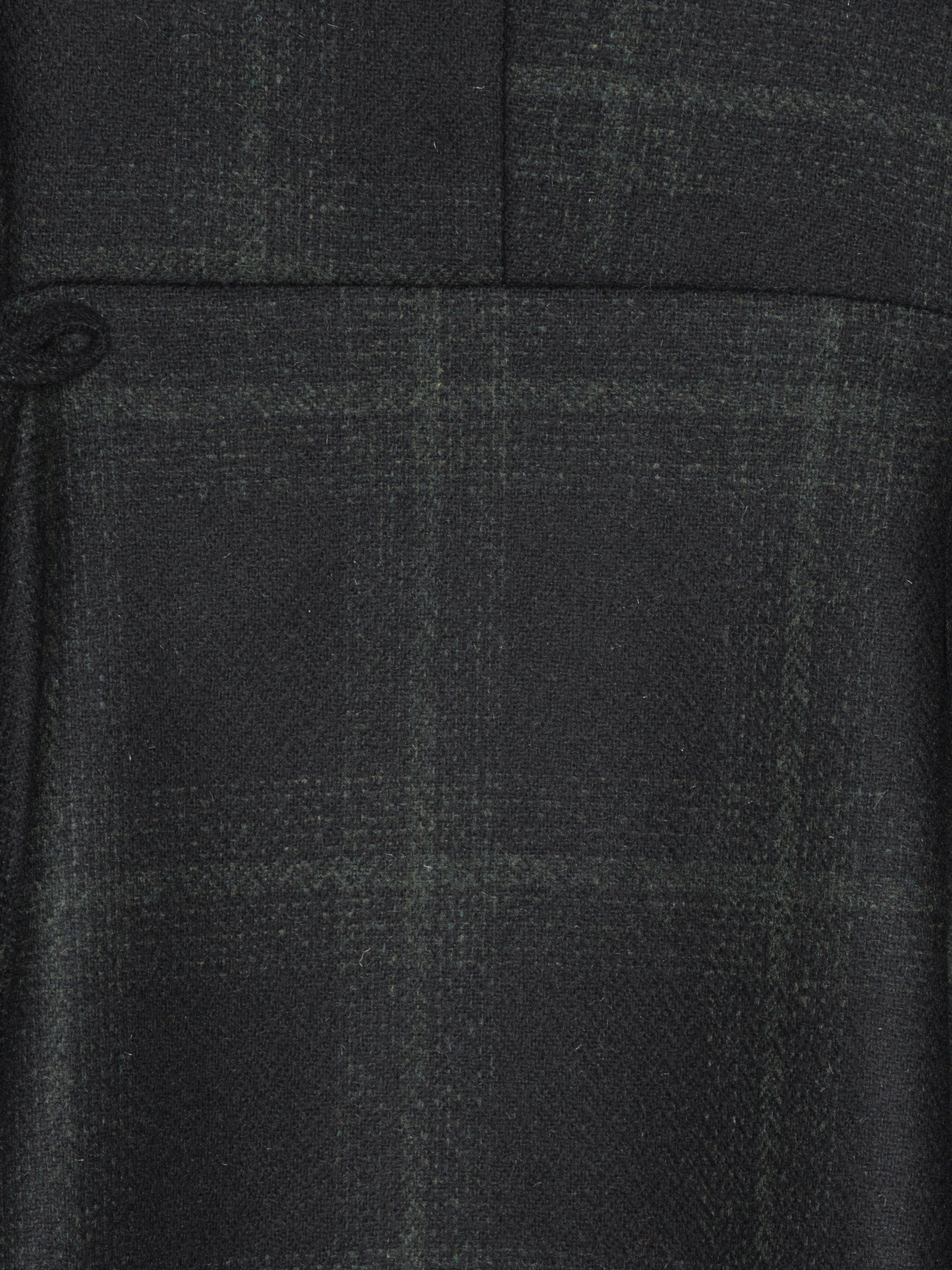 Close-up of a black fabric with a subtle check pattern