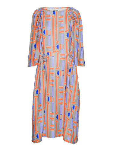 Colorful dress with geometric pattern from Henrik Vibskov on a white background