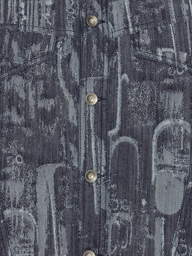 Close-up of grey-blue denim jacket with abstract pattern from Henrik Vibskov on a white background