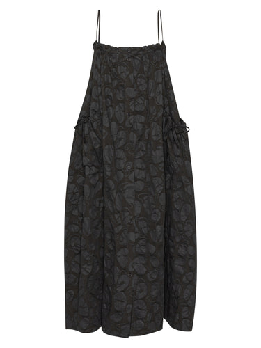 Black-on-black pattern, sleeveless dress from Henrik Vibskov on a white background.