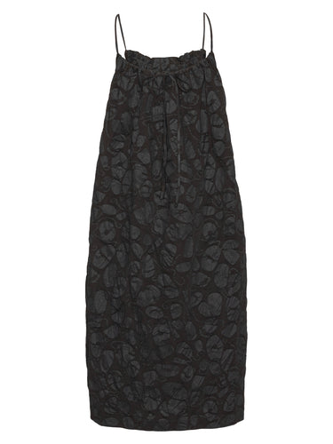 Back view of a black-on-black pattern, sleeveless dress from Henrik Vibskov on a white background.