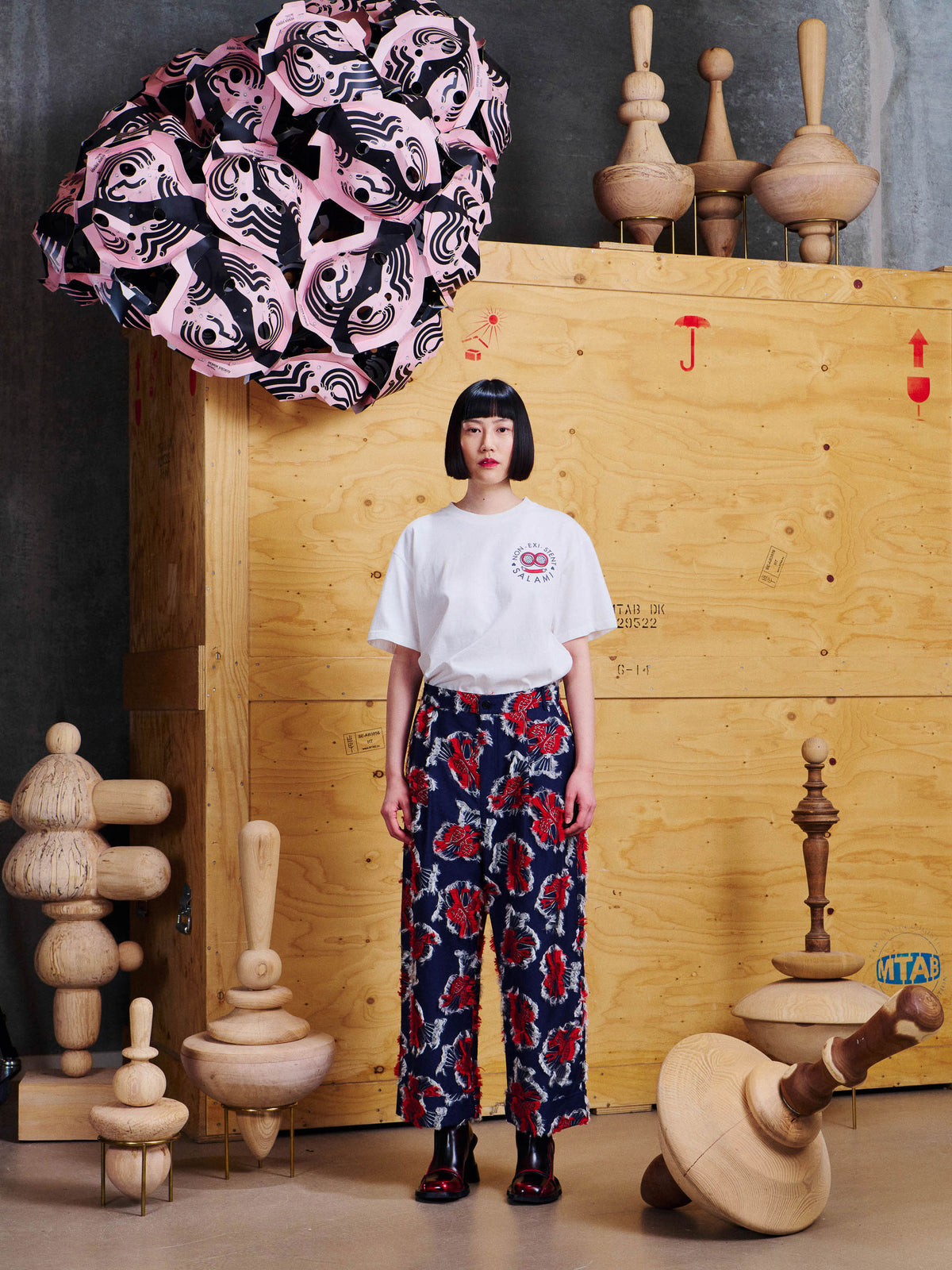 Henrik Vibskov Say Cotton Pants in Red Navy Birdy worn front view with a white T-shirt, showing the relaxed cropped fit, side pockets and textured bird jacquard.