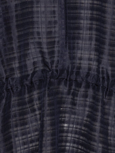 Close-up of the navy dress's material