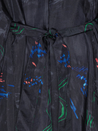 Black dress with colorful abstract patterns on a close-up view