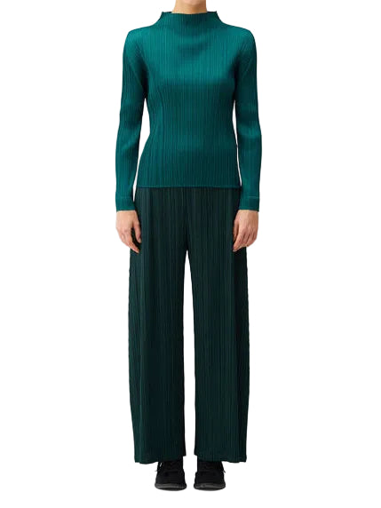 Issey Miyake PLEATS PLEASE! October AW26 Basic Mock Neck Shirt in Blue Green worn on a model, showing the slim pleated silhouette, long sleeves and structured mock neck.