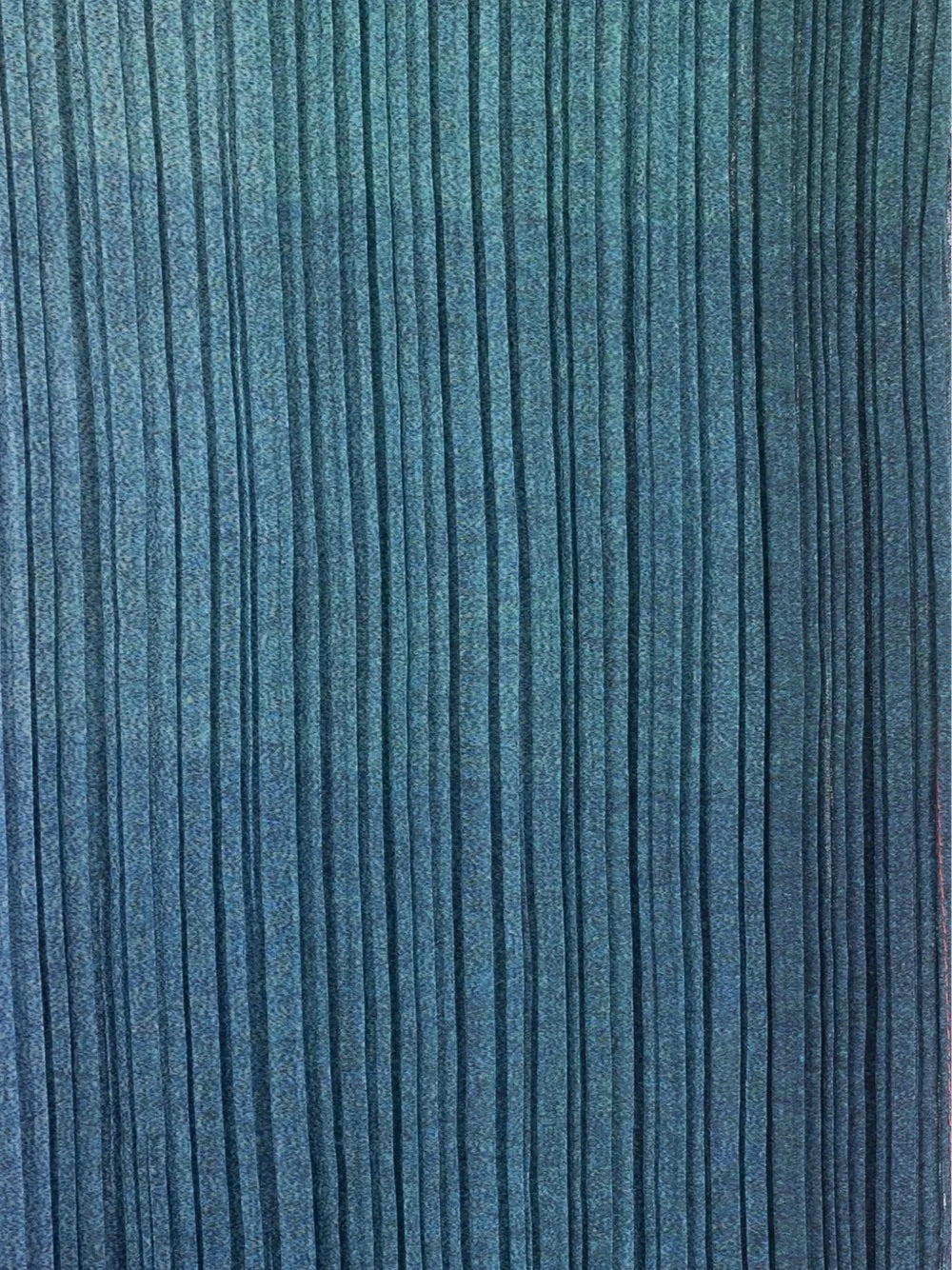 Close-up of blue pleated fabric