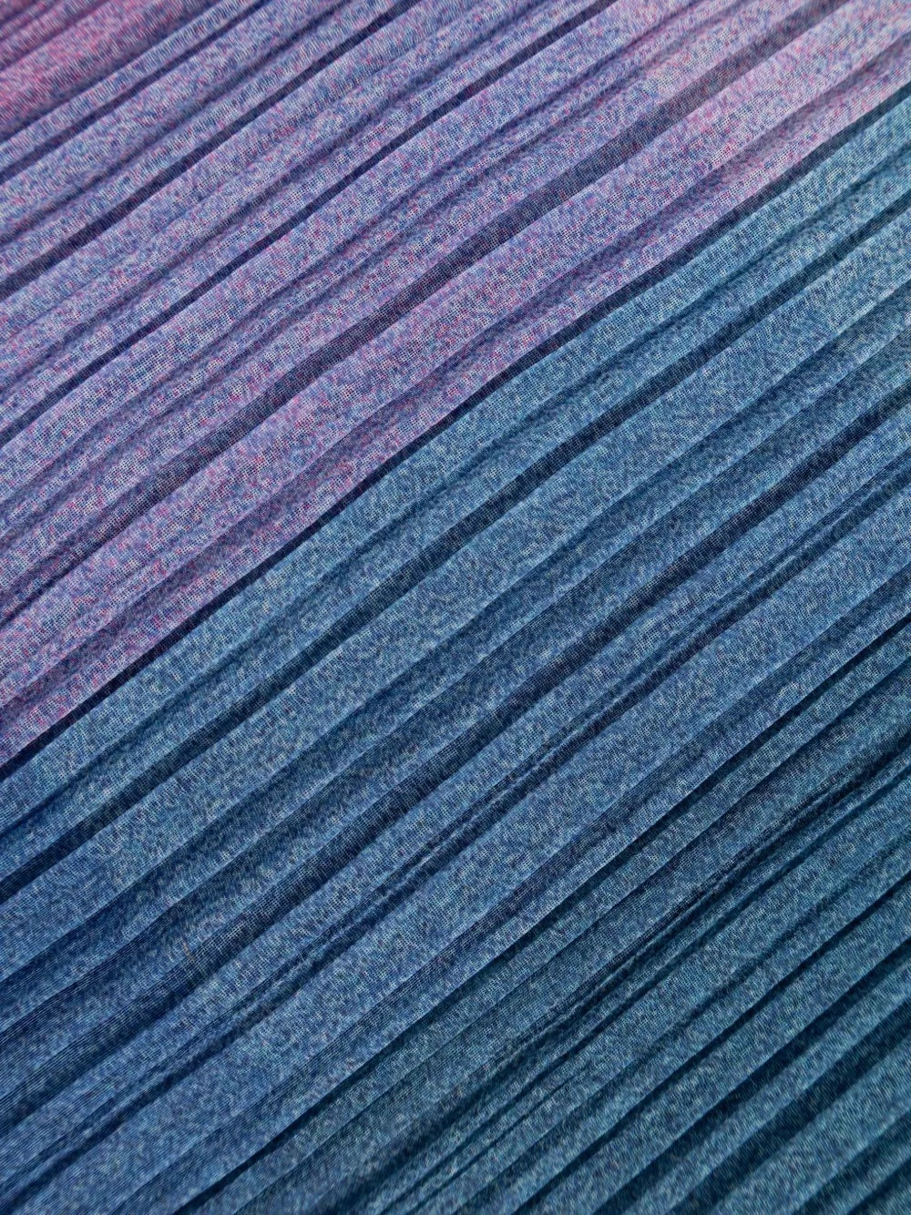 Close-up of pink and blue pleated fabric
