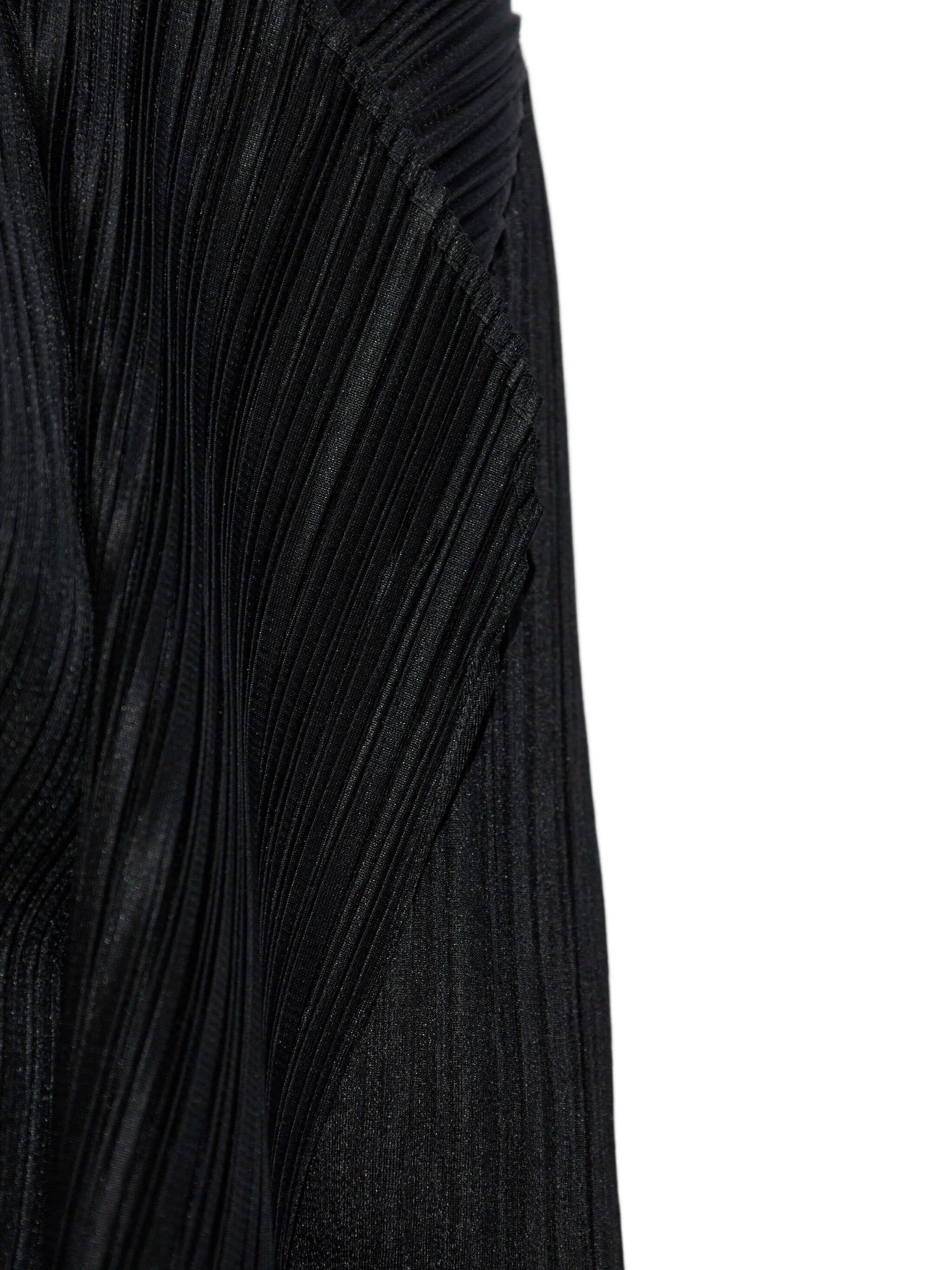 Close-up of a black pleated cardigan on a white background