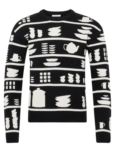 Black sweater with white kitchen-themed pattern on a white background