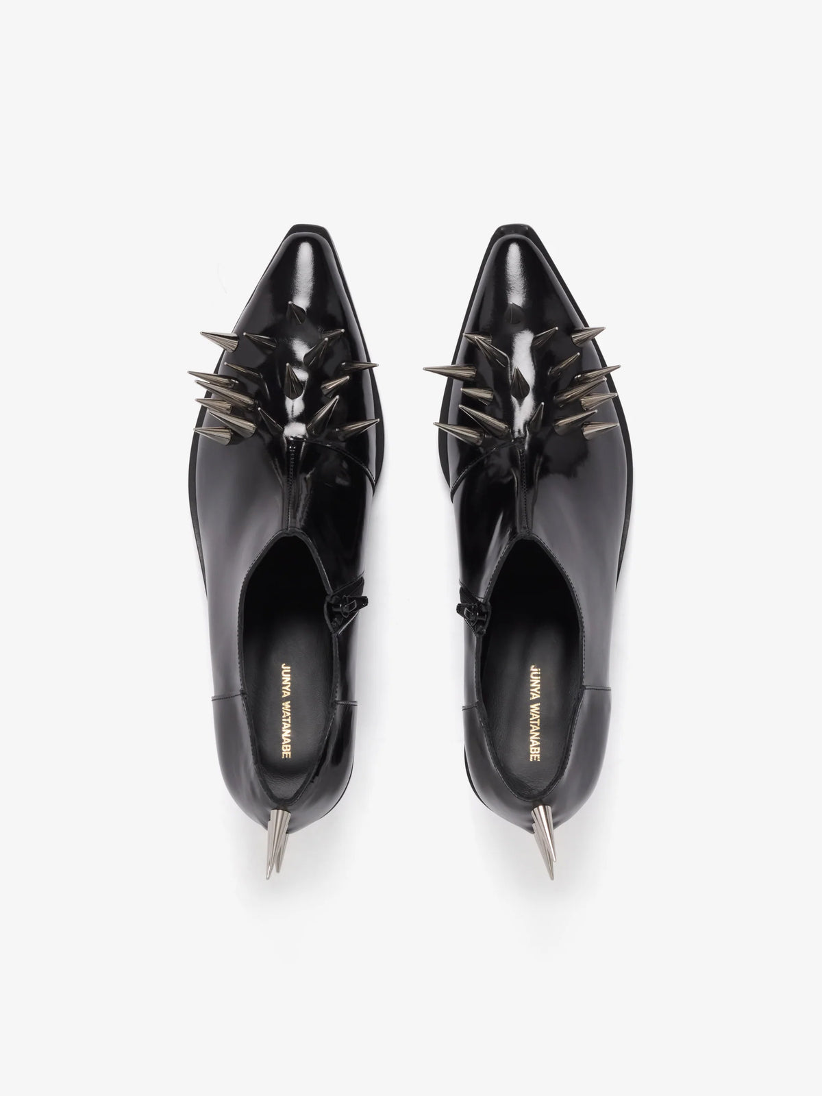 Junya Watanabe Women's Spiked Leather Shoes in Black, top view showing the pair with pointed toes and glossy patent leather finish.