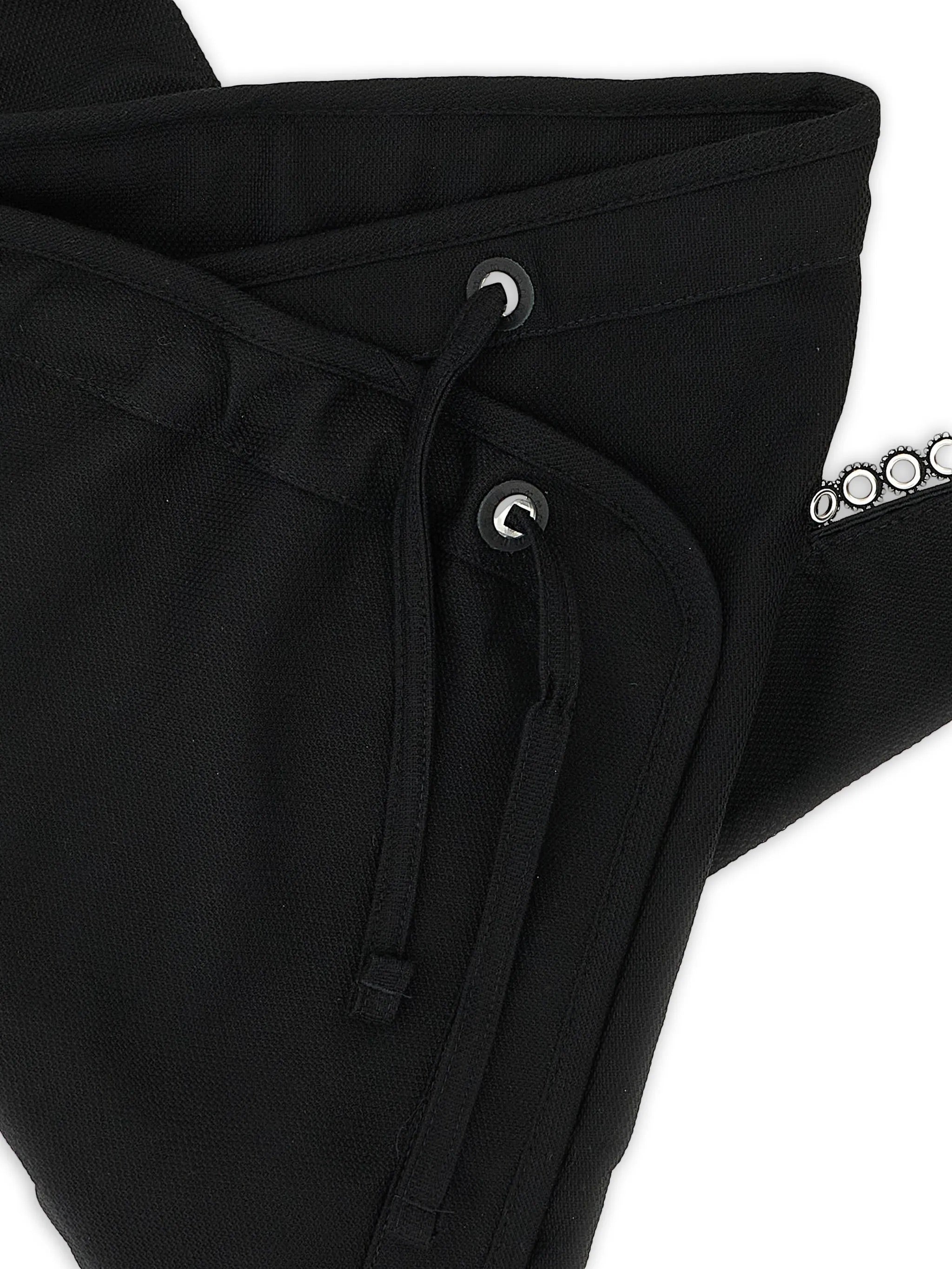 Close-up of the drawstring closure and metal eyelet detailing on the Kest Pouch Bag.