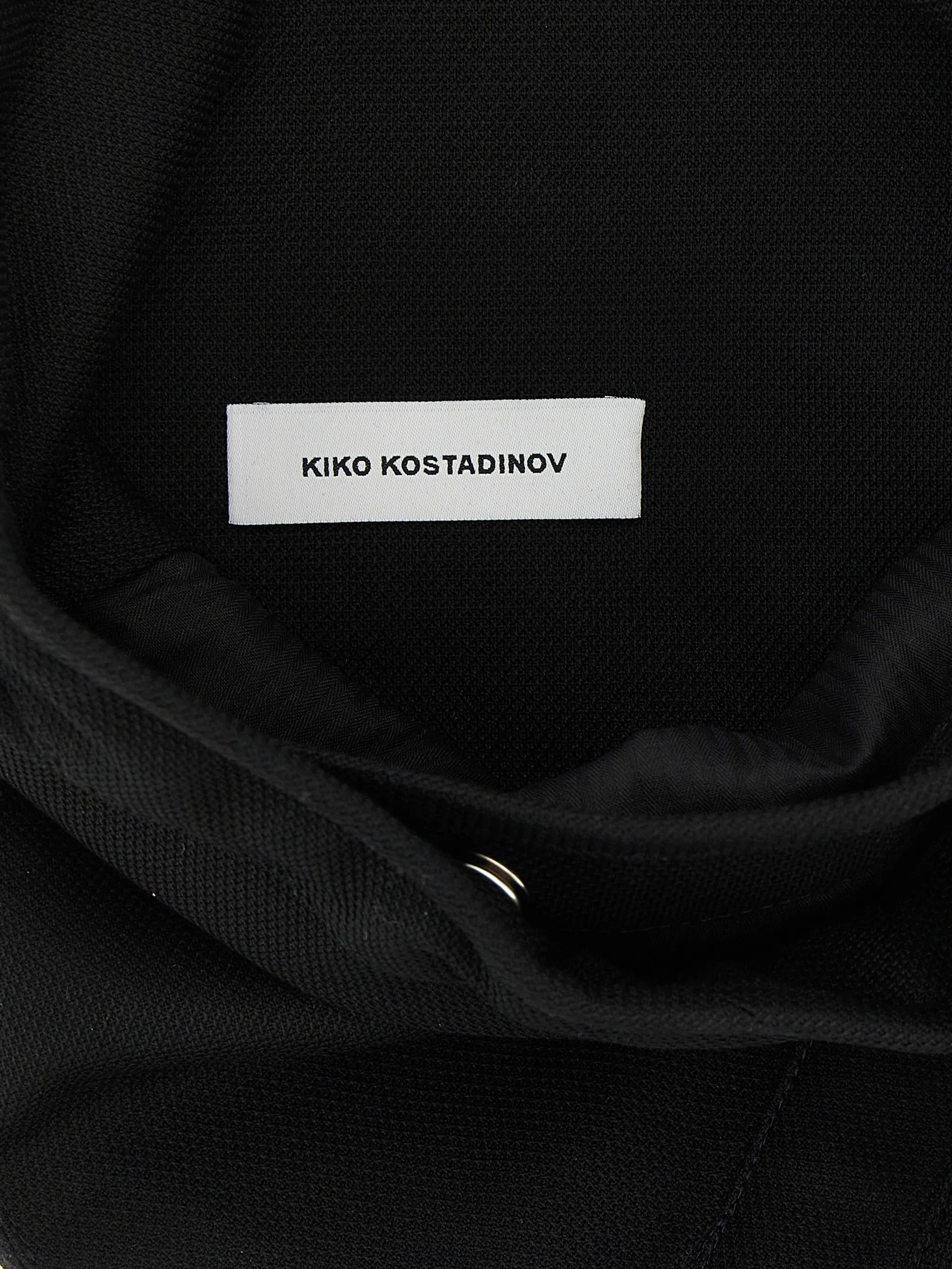 Interior view of the Kiko Kostadinov Kest Pouch Bag showing the logo patch.