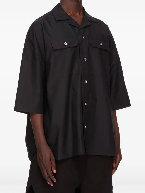 Rick Owens DRKSHDW Oversized Button-Up Shirt in black cotton twill shown on model with relaxed oversized fit, short sleeves and chest patch pockets.