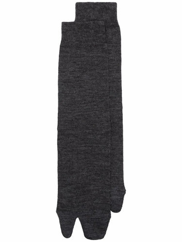 Pair of dark gray womens Tabi socks on a white background