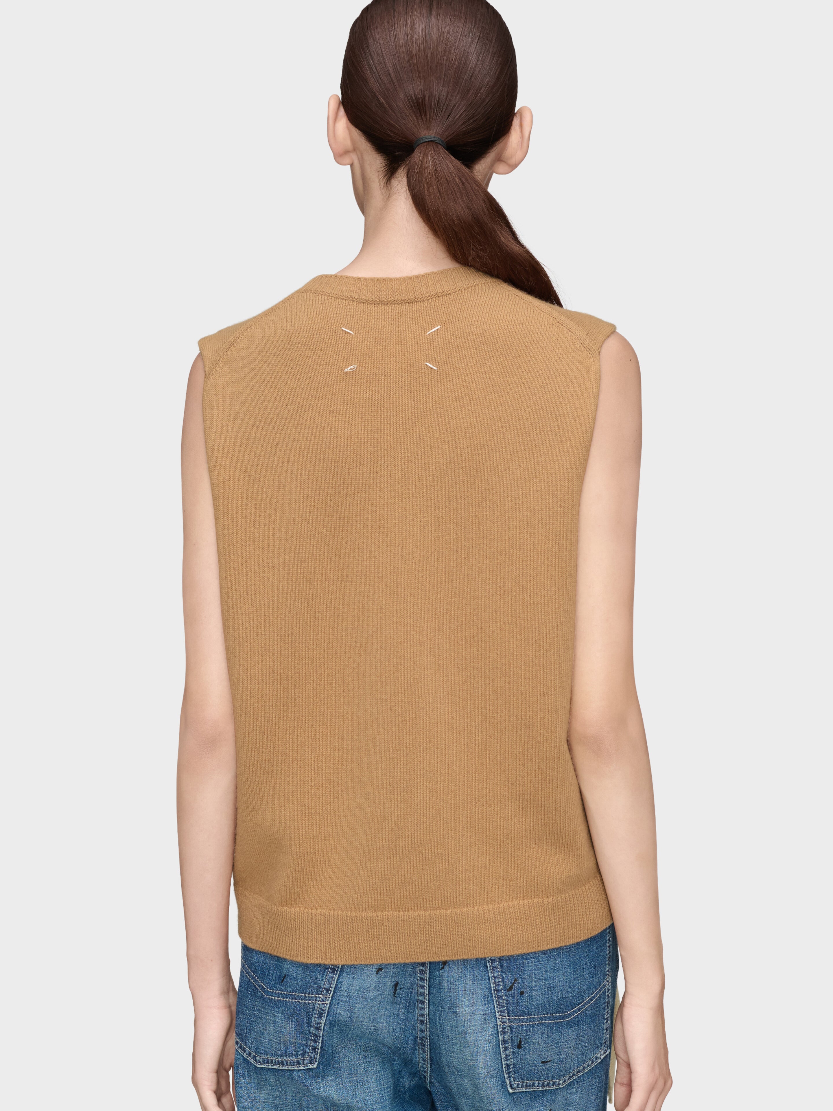 Back view of Maison Margiela Fuse Knit Top in camel beige with signature four white stitches and clean sleeveless silhouette