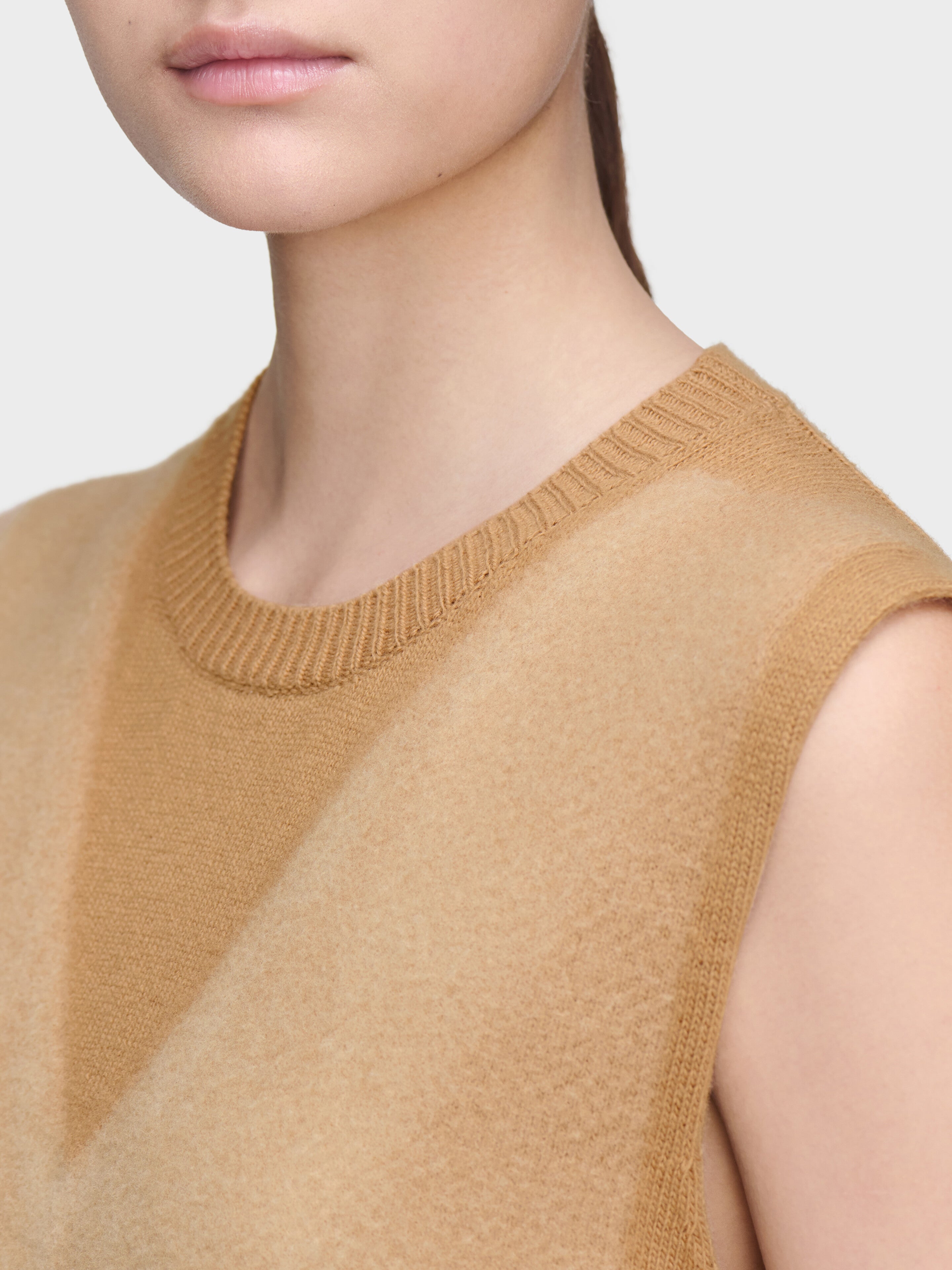 Close-up of Maison Margiela Fuse Knit Top showing ribbed crew neck, camel knit texture and trompe l’oeil V-neck effect
