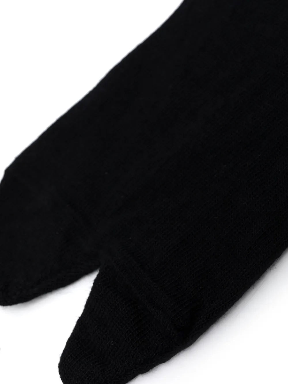 Close-up of Tabi sock on a white background.