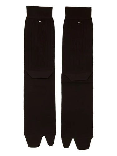 Pair of dark brown tabi socks on a white background