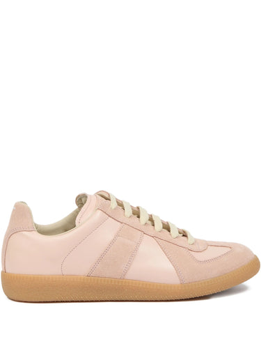 Soft pink leather sneakers with panel design from Maison Margiela on a white background